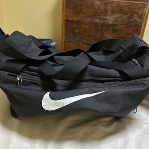 Nike black duffel bag!! Very spacious and only used once!